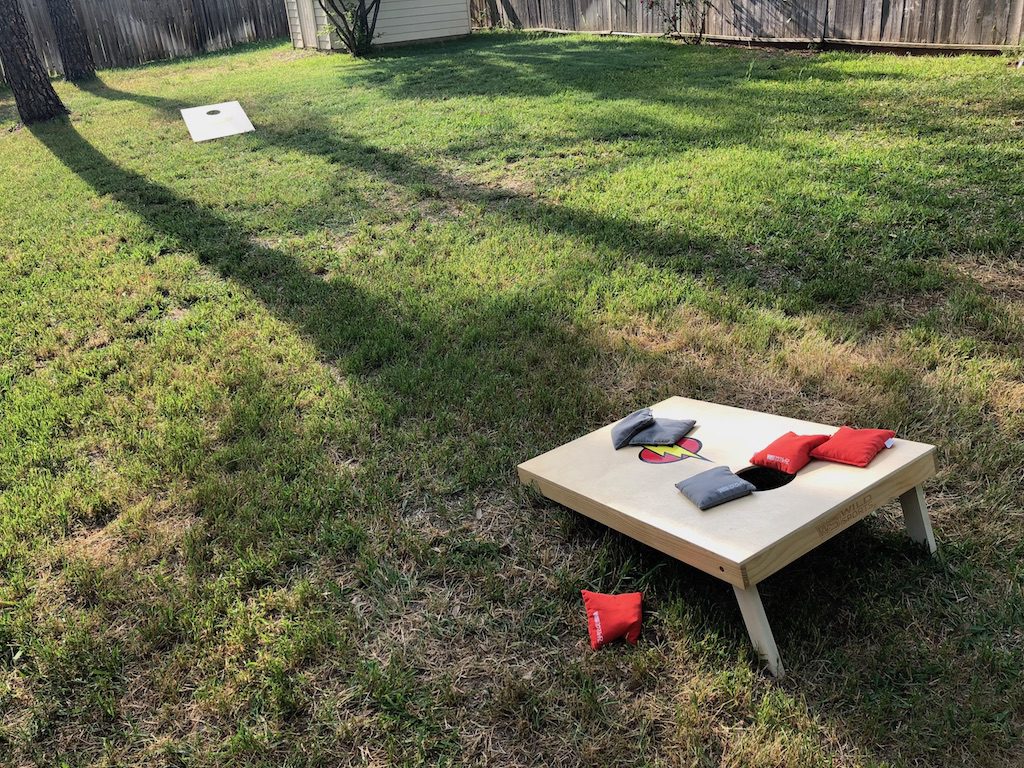 Cornhole boards in the backyard.